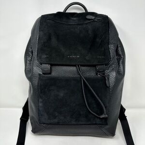 Coach Manhattan Backpack crafted in black leather with suede paneling